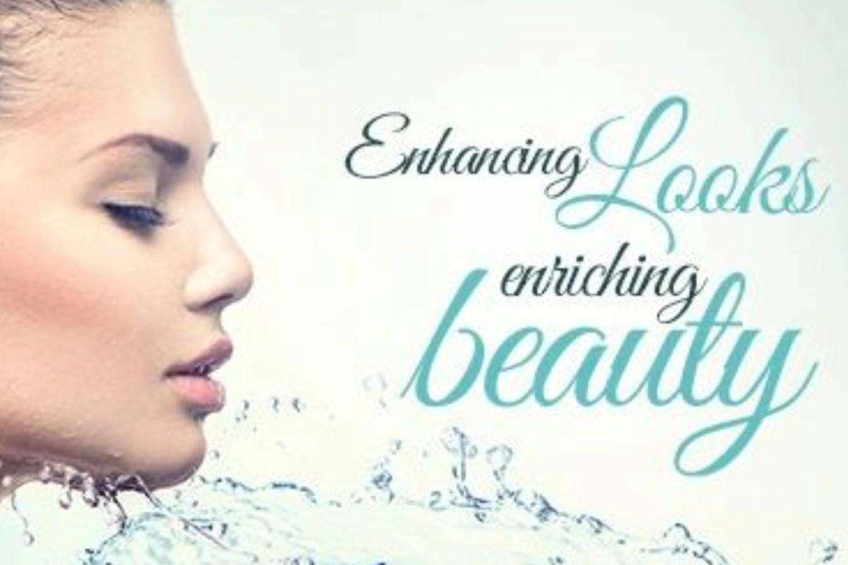 Profile of a woman with water splashing against a light background. The text reads, "Enhancing looks, enriching beauty.