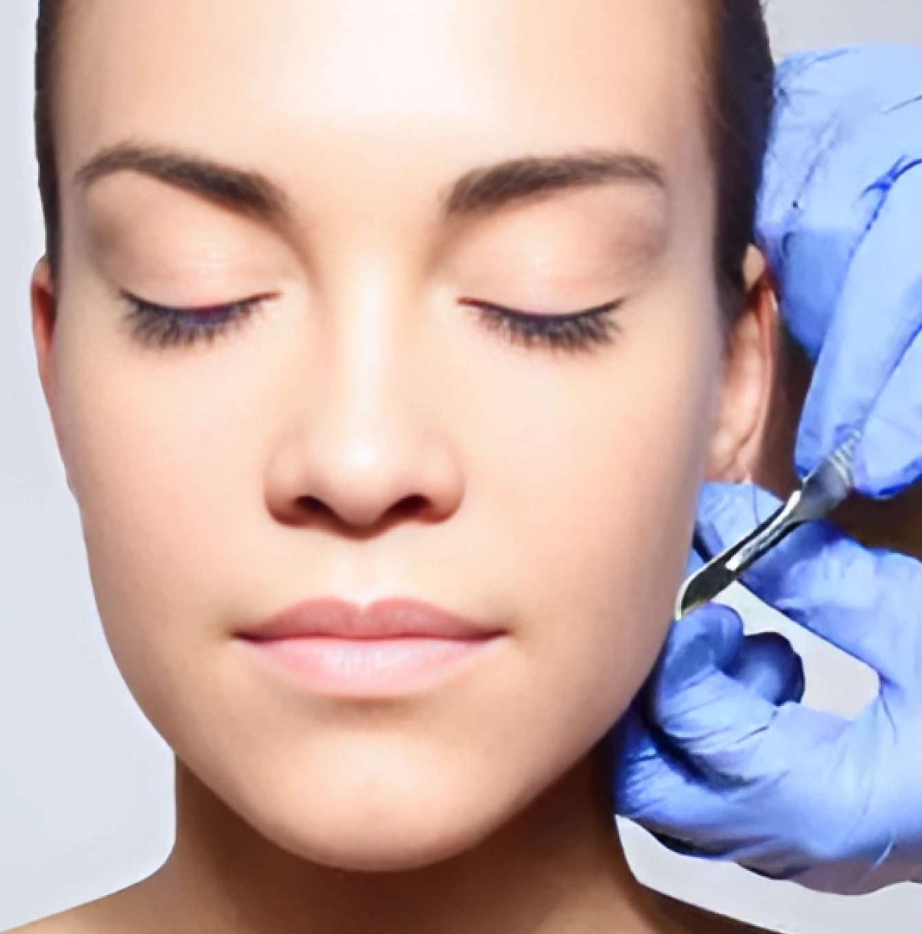 A woman getting an injection into her face.